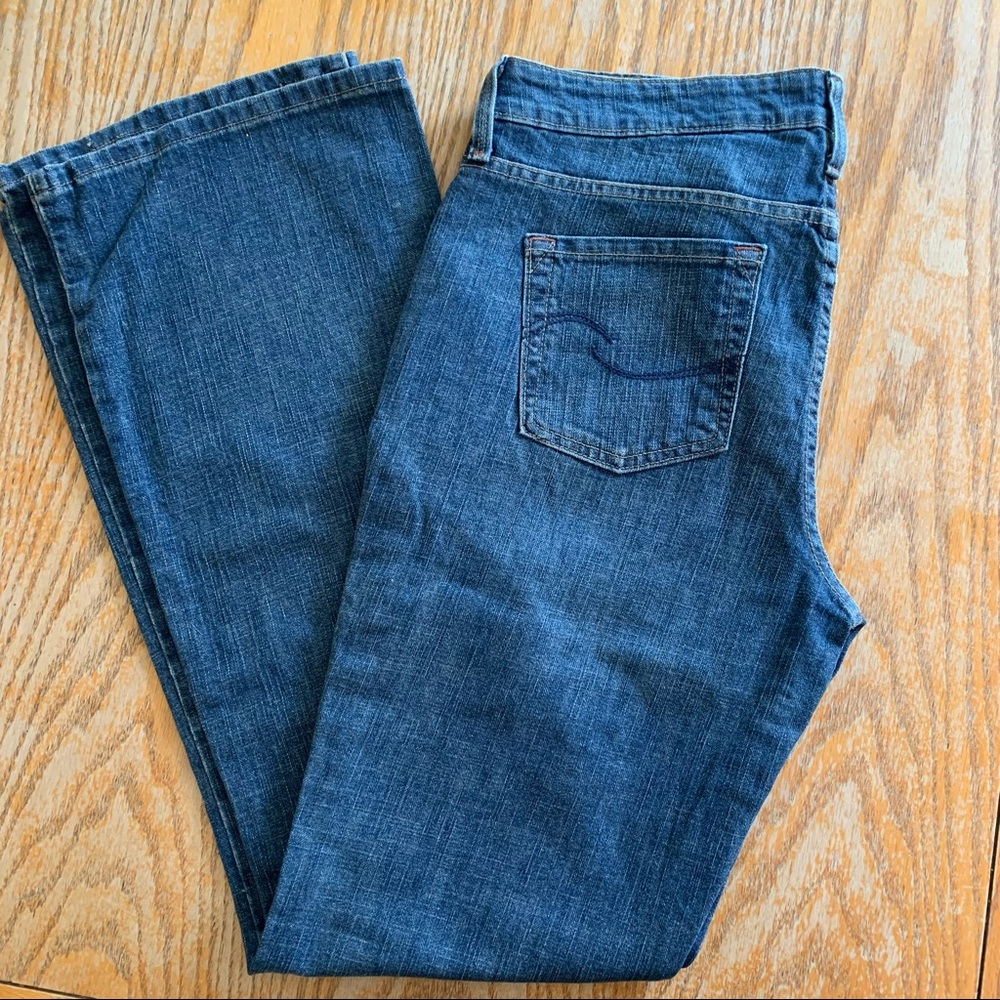 Med blue low rise bootcut long length signature jeans by Levi’s Strauss.